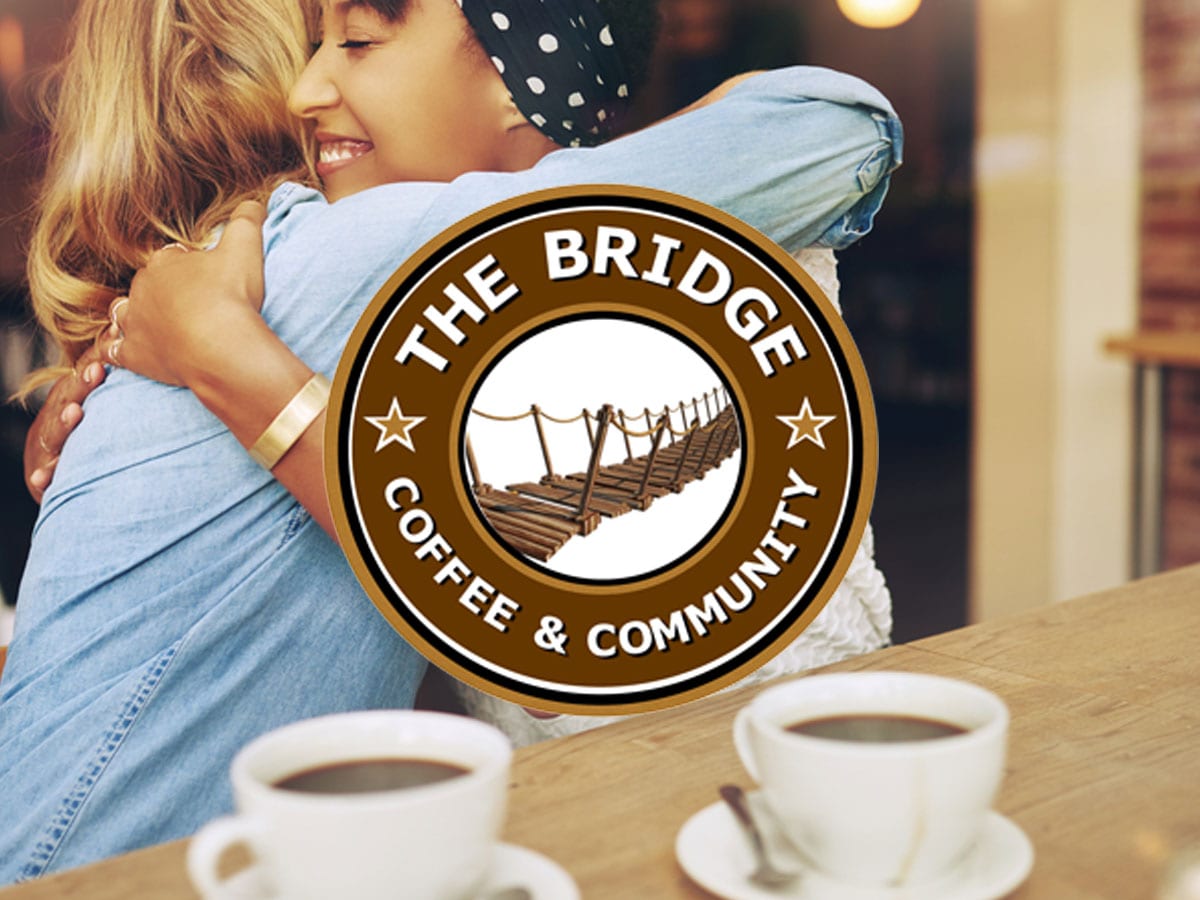 the bridge logo over a picture of girls hugging in a coffee shop
