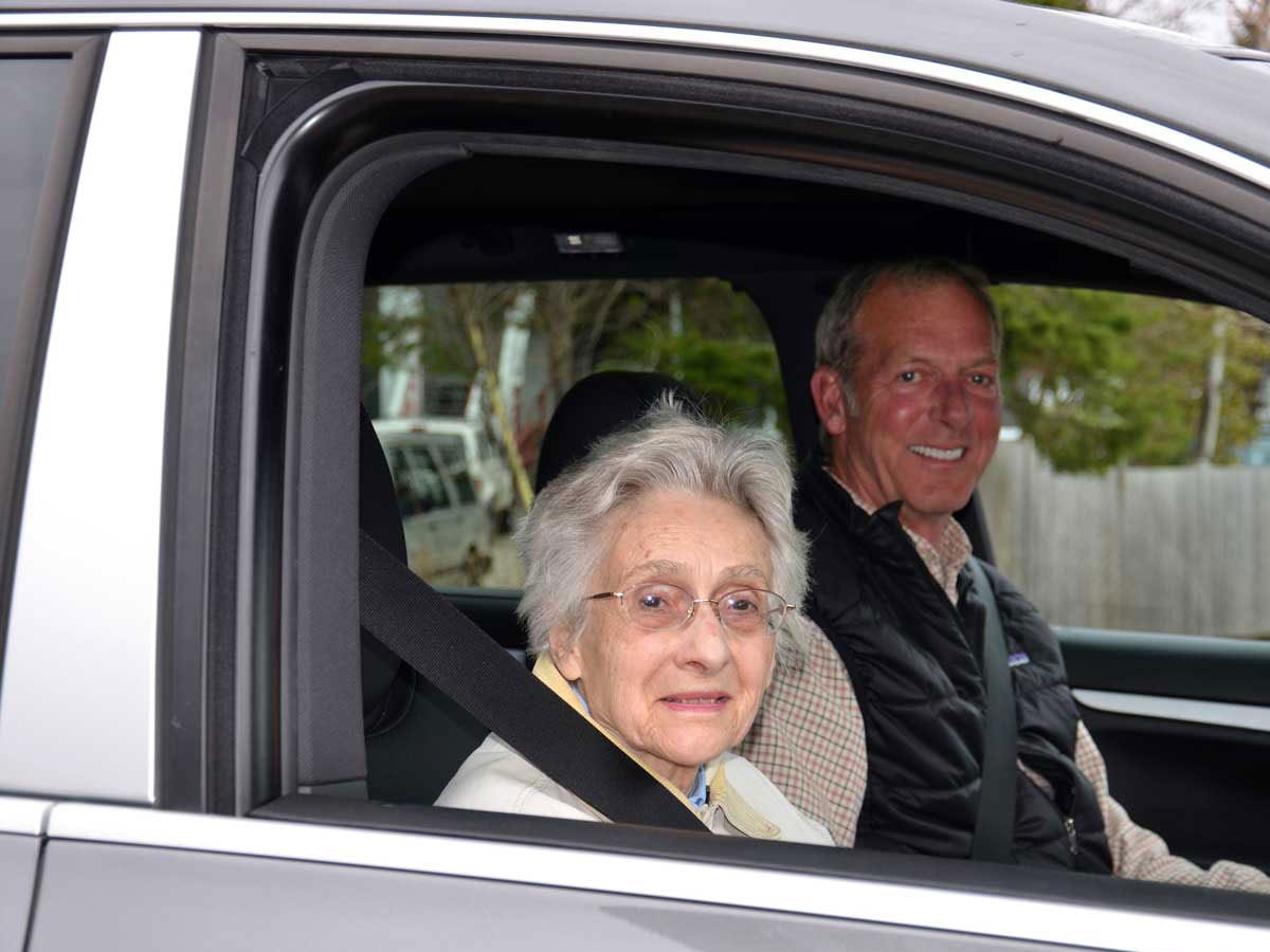 two people riding in a car